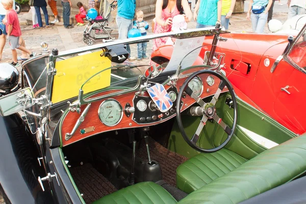 TISNOV, CZECH REPUBLIC - SEPTEMBER 3, 2016:  The traditional meeting of fans of vintage cars and motorbikes. An exhibition of old cars in the town square of Tisnov. Detail of veteran cars