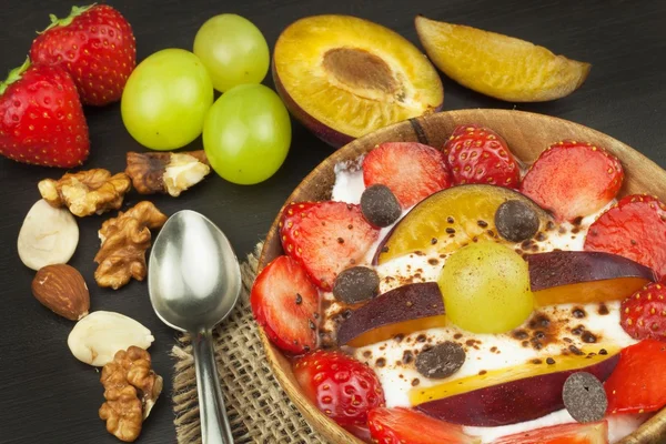 Healthy breakfast with cereals and colorful fruits. Yogurt with fruit and oatmeal. Meals for successful athletes. Food for kids.