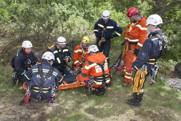 Kadan, Czech Republic, June 6, 2012: Exercise rescue units. Training rescue people in inaccessible terrain at the dam Kadan. Recovery using rope techniques