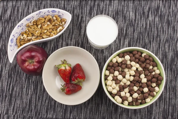 Healthy breakfast, diet meal of cereal, fruit and nuts. Processing menu