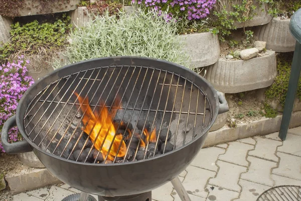 Barbecue grill, charcoal and Flames of Fire, igniting the grill