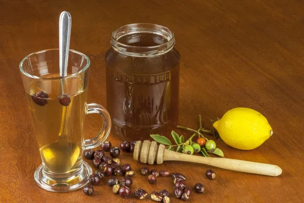 Hot tea with lemon and red arrow in the table. Home treatment for colds and flu. Treating colds using traditional recipes.