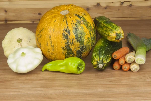 Autumn harvest vegetables. Growing organic vegetables in the country. Diet food for weight loss. Different kinds of vegetables on a wooden kitchen table. Background with vegetables.