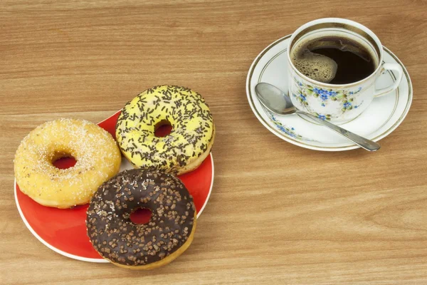 Sweet donut with coffee. Sweet treat with coffee. Donut as quick homemade treats. Junk food diets enemy. A symbol of junk food and obesity, donut for a snack.