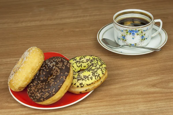 Sweet donut with coffee. Sweet treat with coffee. Donut as quick homemade treats. Junk food diets enemy. A symbol of junk food and obesity, donut for a snack.