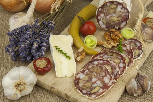 Delicious specialty food, salami with walnuts. Refreshments for important guests. Traditional specialty food. Preparation of home entertainment.