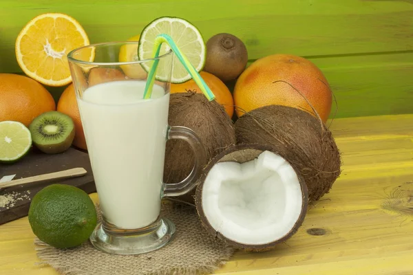 Preparing coconut refreshing drink. Tropical drink. The table at the beach bar. Preparing cocktail. Tropical fruit for making alcoholic cocktail.