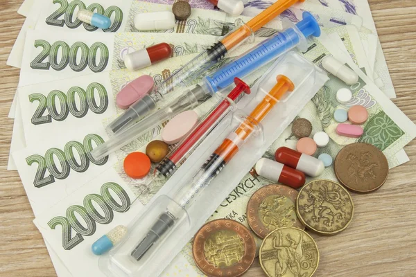 Health care financing. The concept of paying medical acts. Valid Czech banknotes and coins. Various kinds of drugs.
