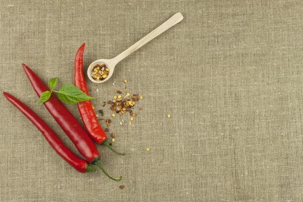 Chili peppers on a canvas background. The ingredients for spicy food. Place for text.
