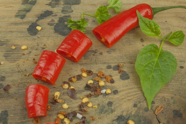 Chilies on wooden background. The ingredients for spicy food. Place for text.