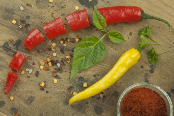 Chilies on wooden background. The ingredients for spicy food. Place for text.