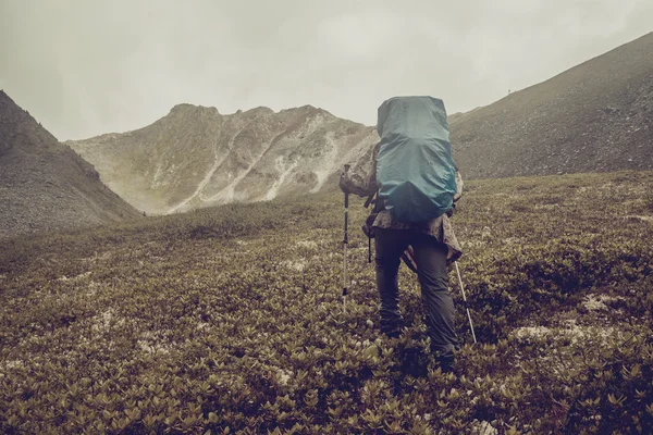 Man climbs a mountain at the beautiful view