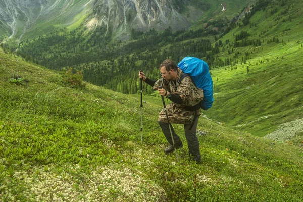 Man climbs a mountain at the beautiful view