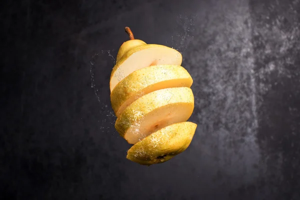 Falling slices of pear in air