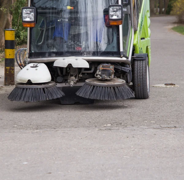 SWEEPER CAR IN A CITY PARK ,CLEANING