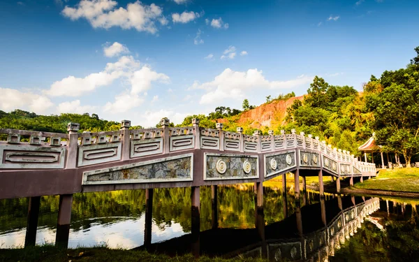 Chinese style bridge on the river