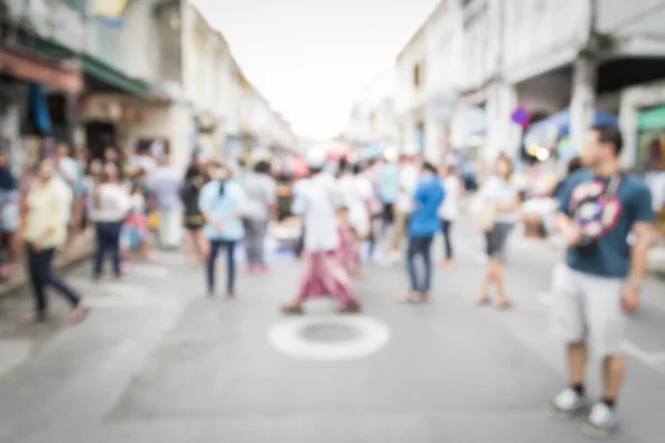 Blurred people walking on the street in phuket old town