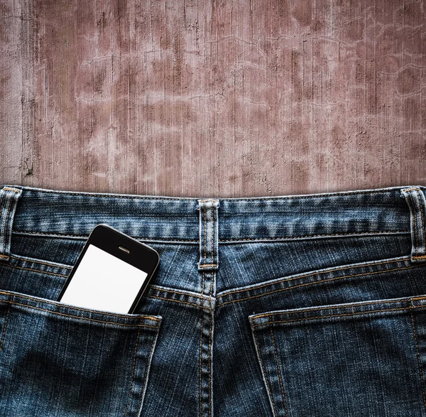 Blue jeans with cell phone in a pocket background