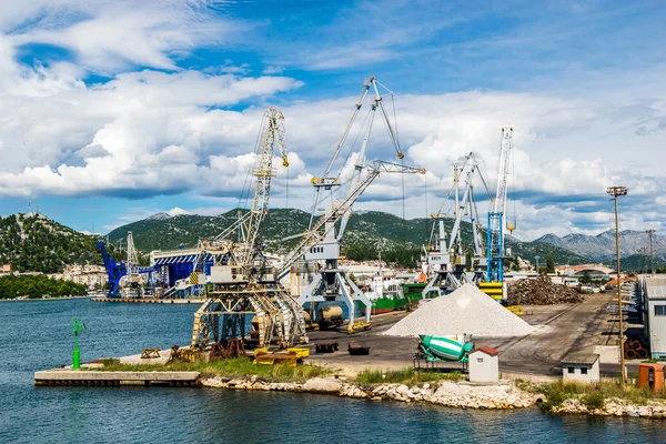 PLOCE, CROATIA - AUGUST 6, 2014: Bulk cargo with port infrastructure in Port Ploce, largest sea port in southern Croatia.