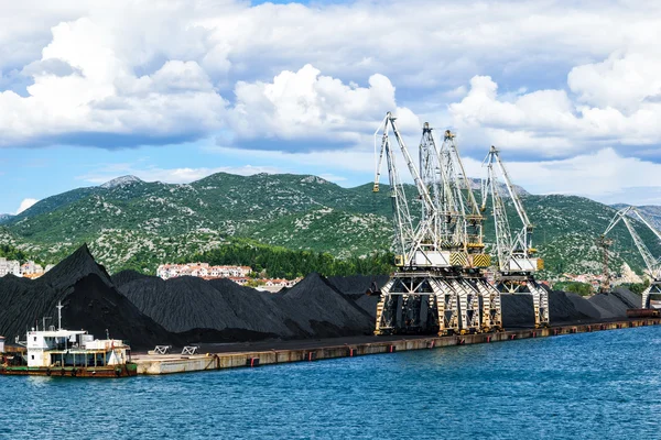 PLOCE, CROATIA - AUGUST 6, 2014: Bulk cargo with port infrastructure in Port Ploce, largest sea port in southern Croatia.