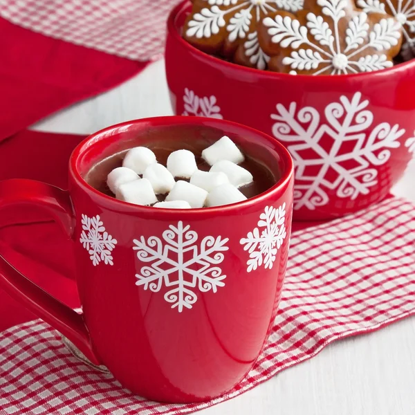 Mug with hot chocolate  and gingerbread cookies on wooden table