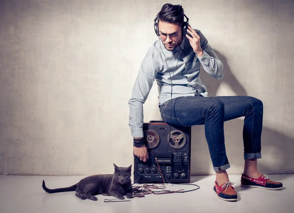 Man and cat listening to music