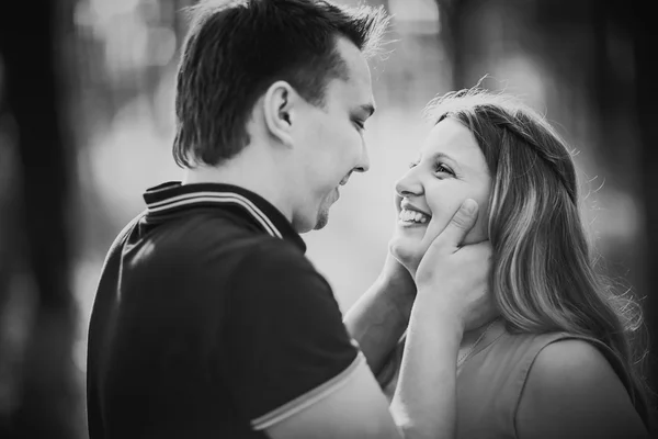 Black white photography romantic young couple laugh on background summer forest