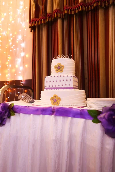 Beautiful multi-tiered wedding cake with purple tones