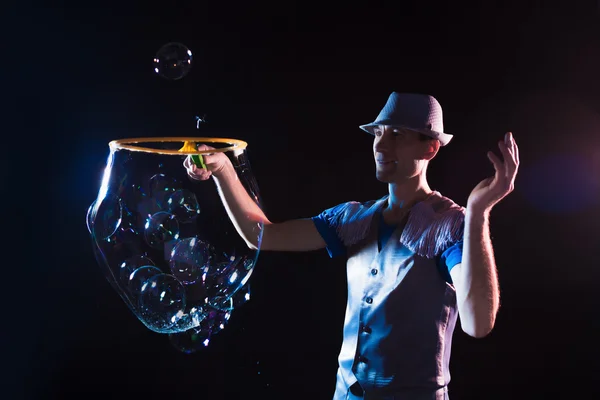 Man with  big soap  bubbles