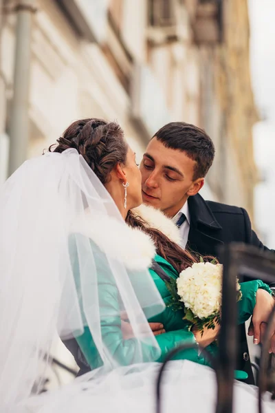 Morning wedding kiss in Prague