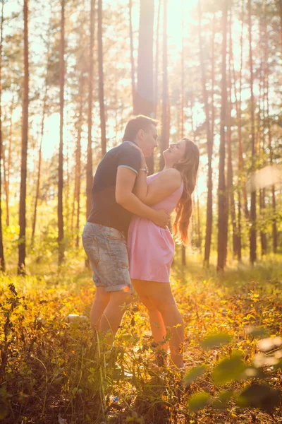 Romantic young couple laugh on background summer forest