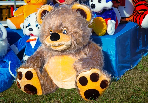 Big toy teddy bear and other children\'s toys.