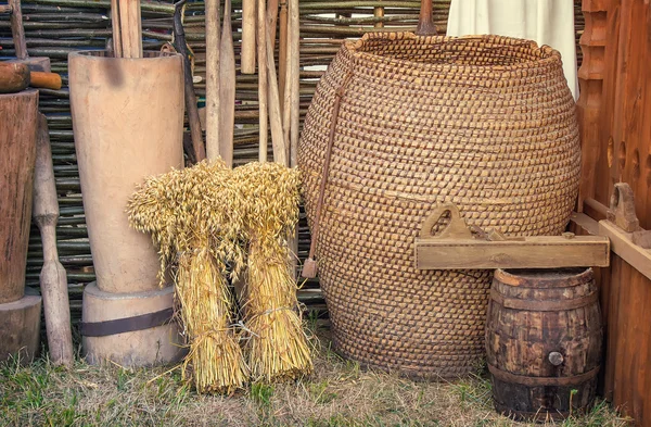 Two beams and ancient objects of rural life.