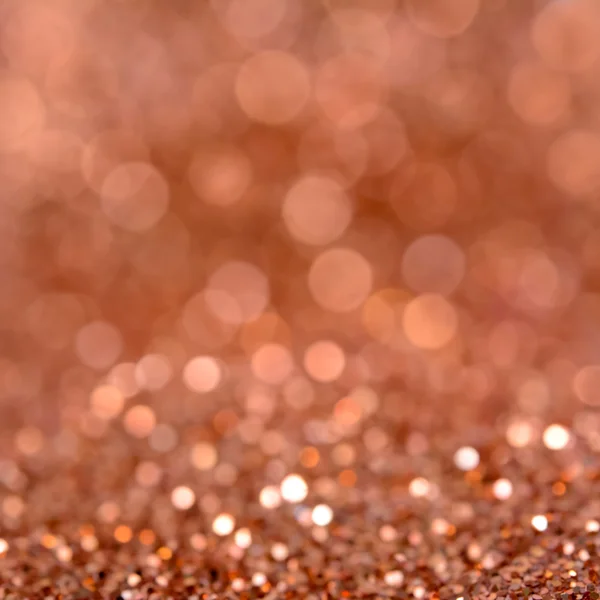 Sparkle orange brown glittering bokeh abstract background