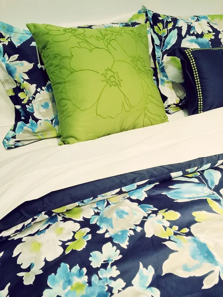 Blue and green bed linen with floral design