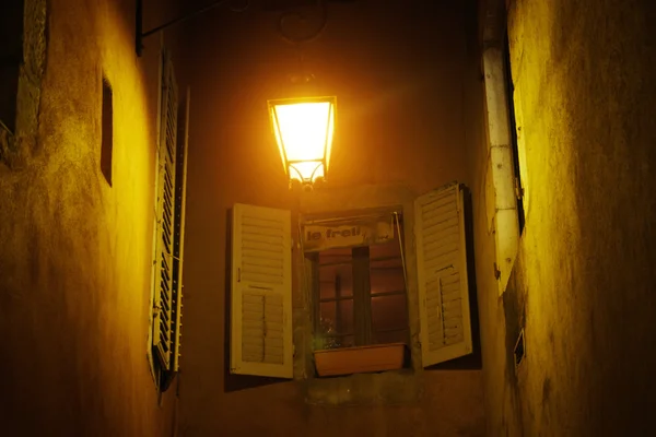 The lantern on the wall by the window at night