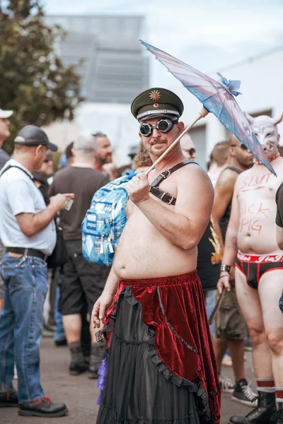 Unidentified people at the annual gay festival Folsom Street Fair in San Francisco, everyone is happy, having fun, and wear Carnival clothing