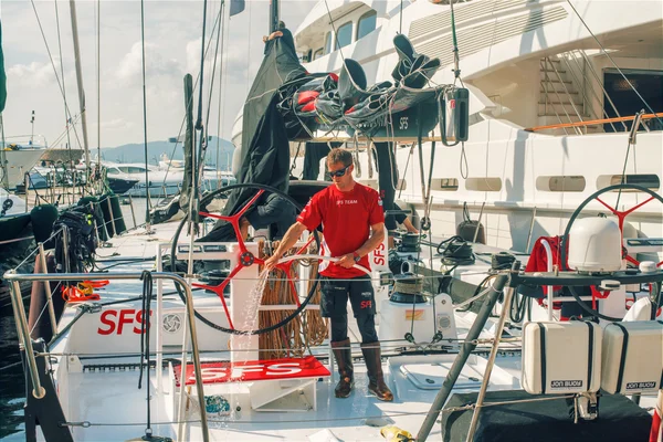 Man clean Luxury Yachts in Saint-Tropez