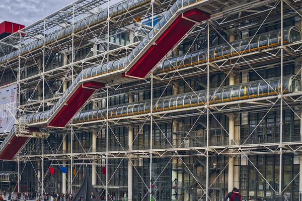 Centre Georges Pompidou (1977) was designed in style of high-tech architecture. It houses library, National Art Modern museum and IRCAM.