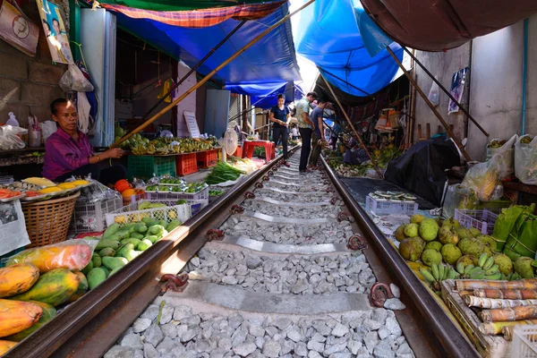 SAMUT SONGKHRAM, THAILAND - 2016 MAY 08: Mae Klong Market placed all product on railroad, all vendors have to move product away when the train passes market.