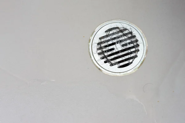 Hair clump in bath drain.