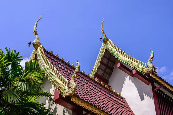 Beautiful gable apex on the roof of buddhist temple.