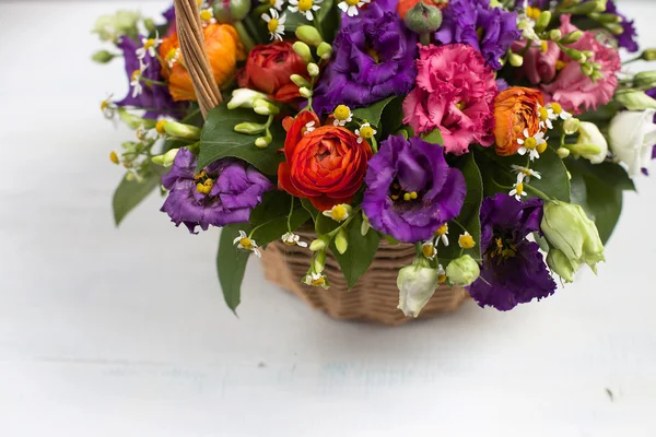 Basket of flowers and greens