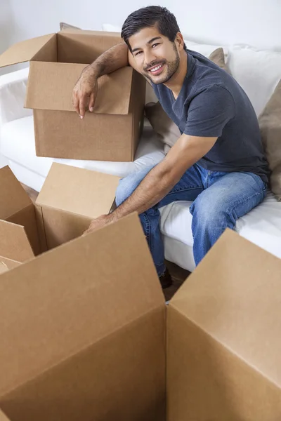 Asian Chinese Korean Man Unpacking Boxes Moving House