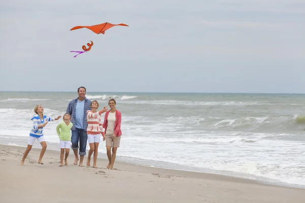 Family Parents Girl Children Flying Kite on Beach