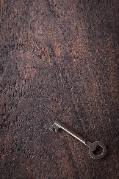 Vintage key on wooden table