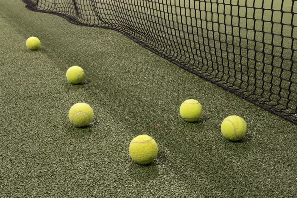 Paddle ball in astroturf court