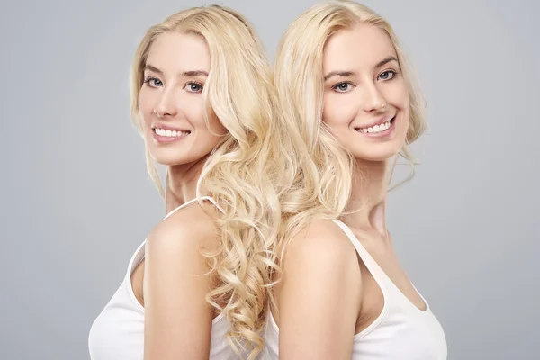 Healthy hair of blonde twins