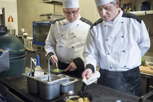 Chefs working in commercial kitchen
