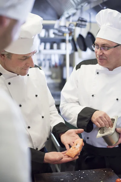 Chefs working in commercial kitchen